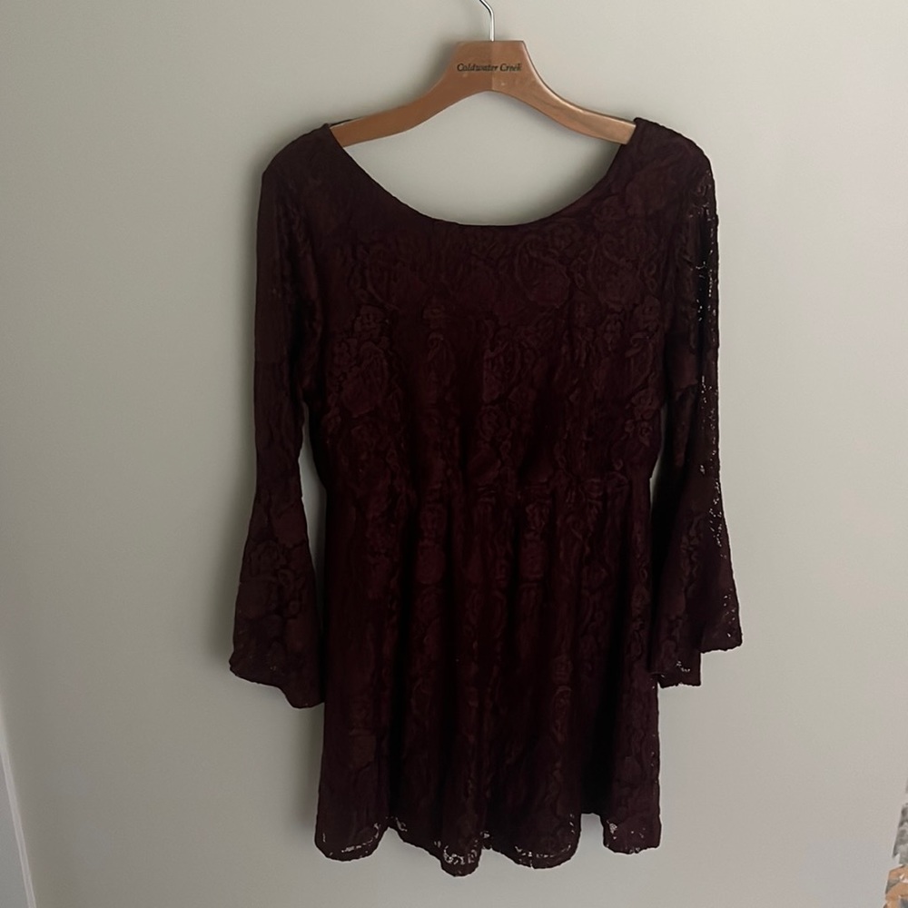 Maroon dress,  above the knee.